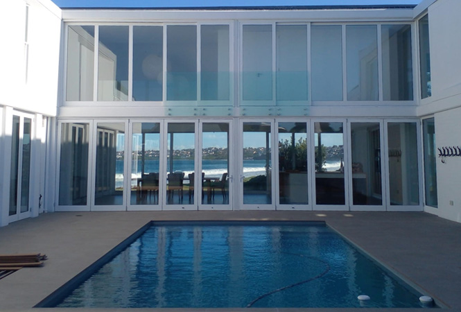 Completed Luxury Residence by Prism Construction Modern double-storey luxury home with a swimming pool, custom-built by Prism Construction