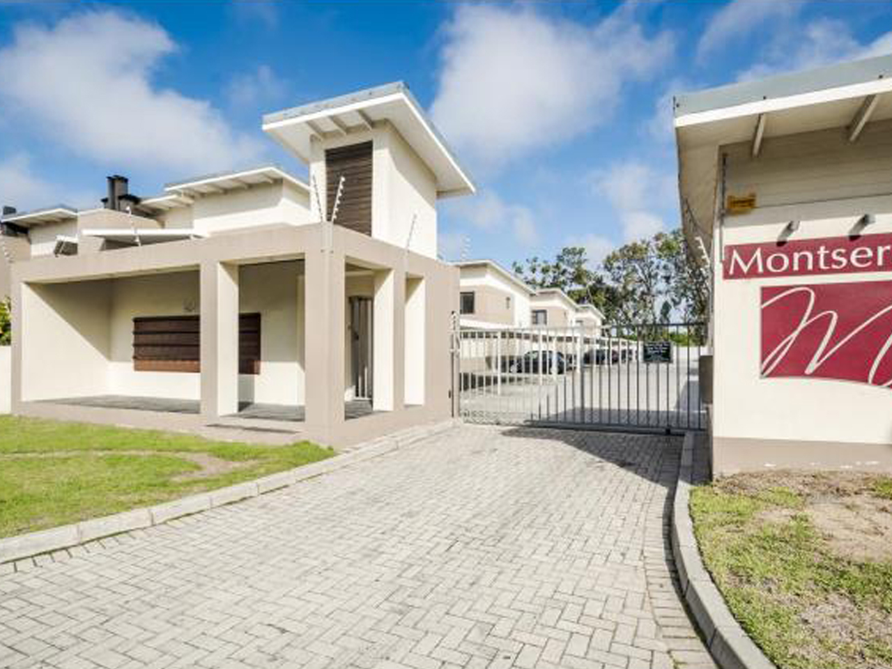 Prism Construction Montserrat Estate Residential Development Modern secure entrance gatehouse of The Montserrat Estate townhouse complex, developed and built by Prism Construction